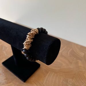 Black and gold tone bracelet